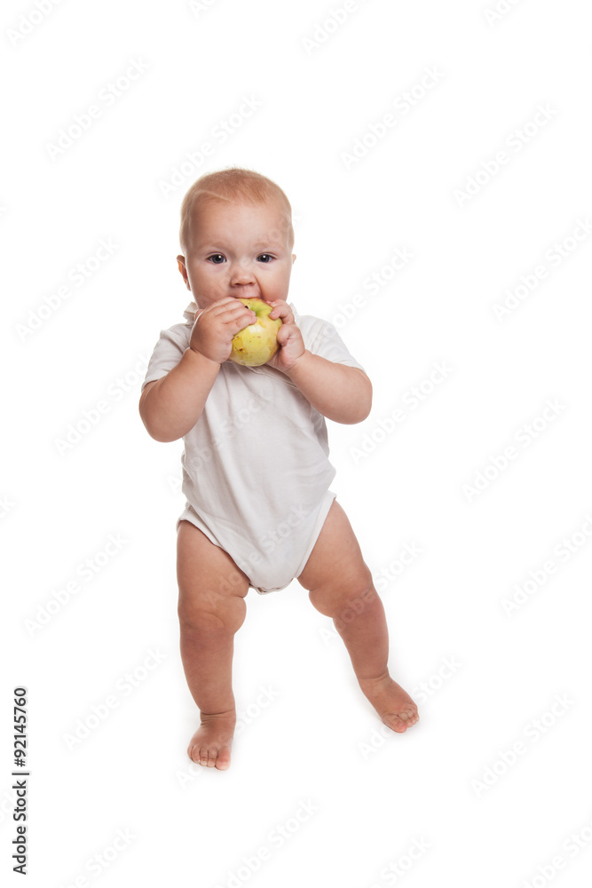 baby walking with an apple on a white background baby walking with an apple on a white background