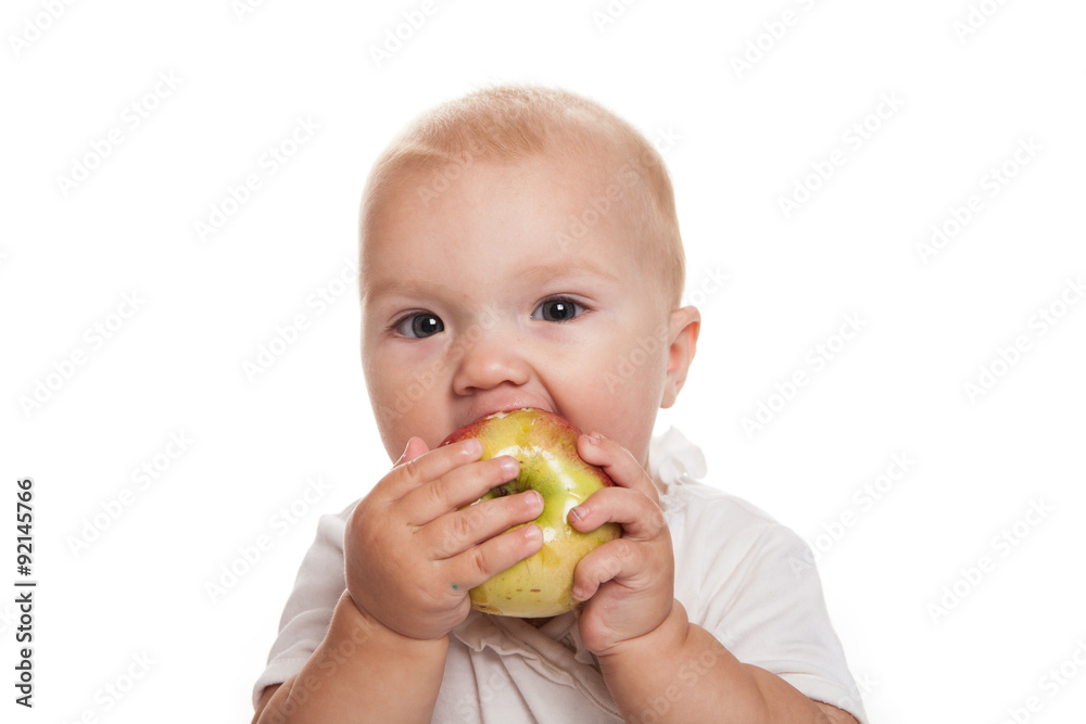 baby with an apple on a white background baby with an apple on a white background