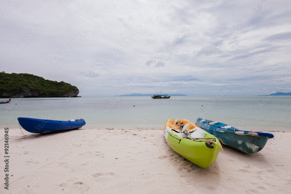 Colorful kayaks on beach in Thailand