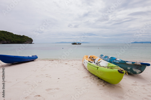 Colorful kayaks on beach in Thailand
