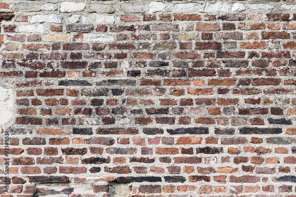 Fototapeta premium a brick wall made from assorted bricks