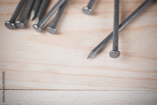 Head and toe nails on wood