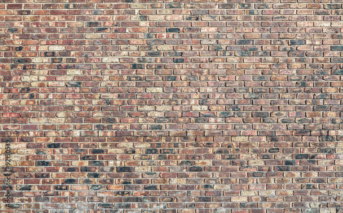 Vászonkép A brick wall made from red bricks