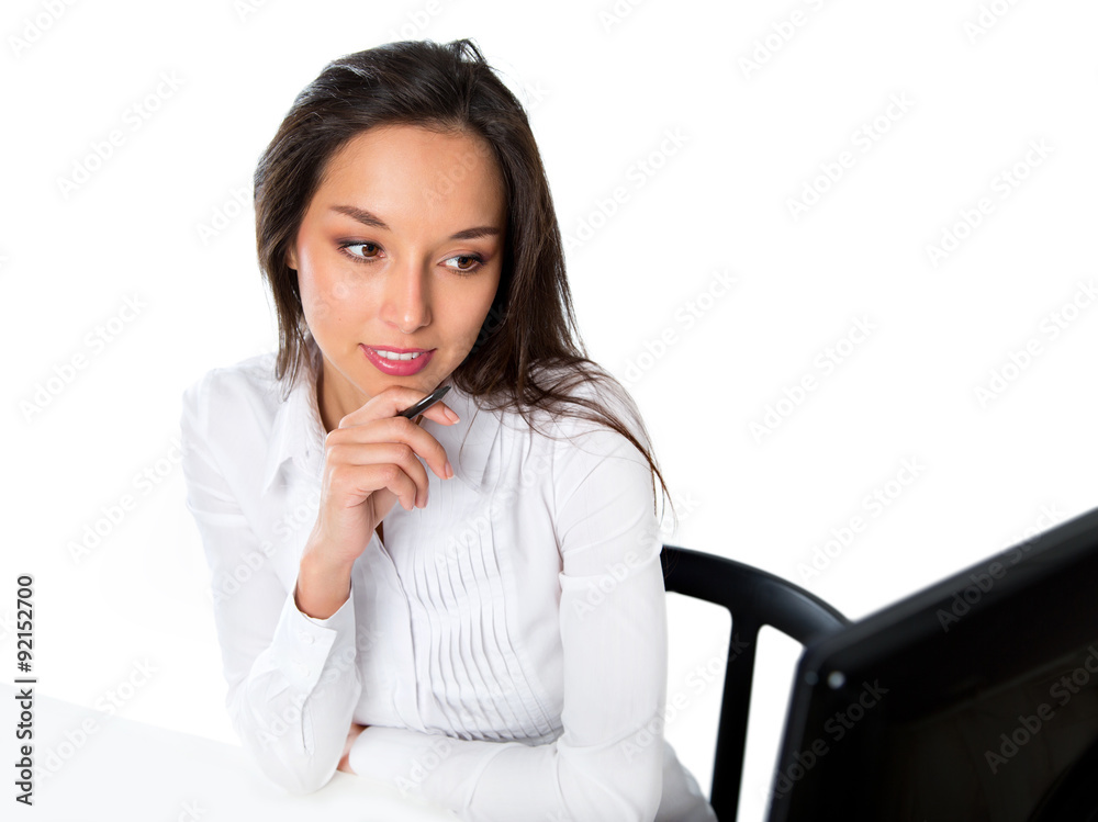 Portrait of a young business woman using computer at office Portrait of a young business woman using computer at office