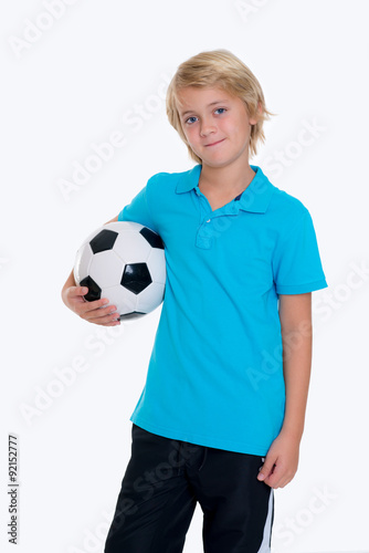 boy with soccer ball in front of white background © Firma V