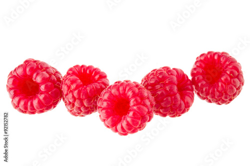 ripe raspberries isolated on white background close up