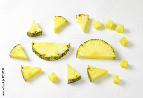 Fresh pineapple slices and wedges