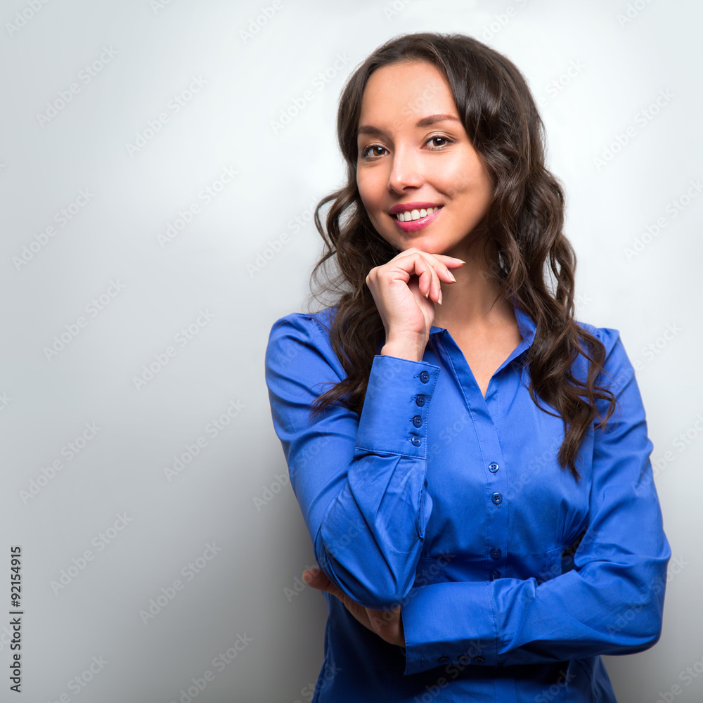 Business woman portrait with crossed arms isolated on gray backg Business woman portrait with crossed arms isolated on gray backg