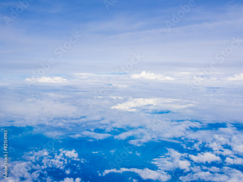 Blue sky with cloud view from window of airplane