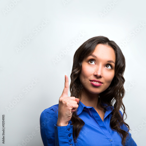 Woman copy space pointing finger. smiling business woman portrai