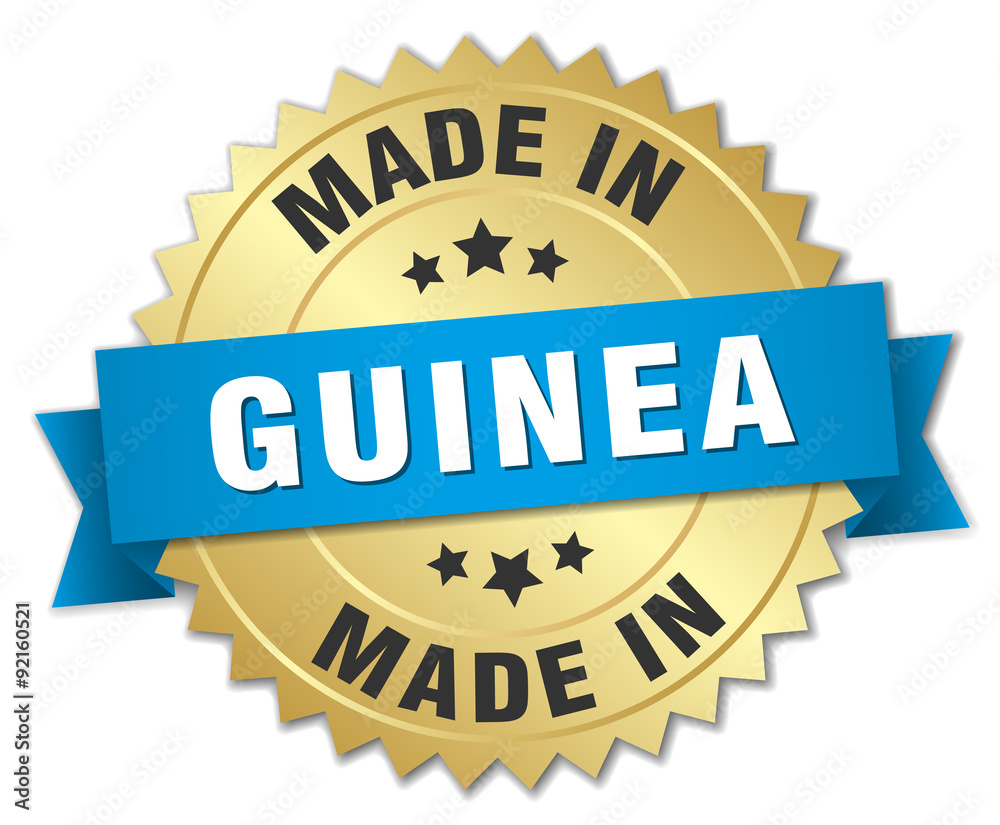 made in Guinea gold badge with blue ribbon