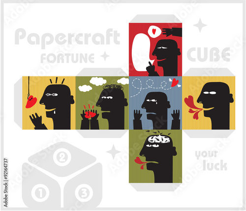 Paper cube with monsters for luck.