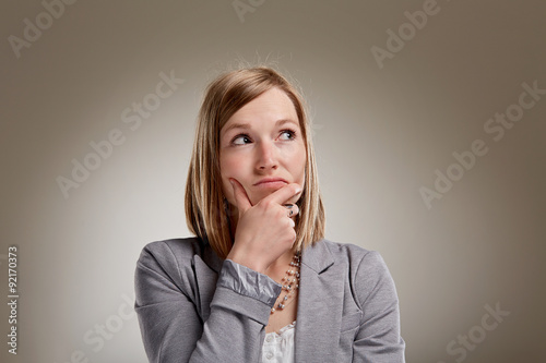 Foto Uncertain young blond woman