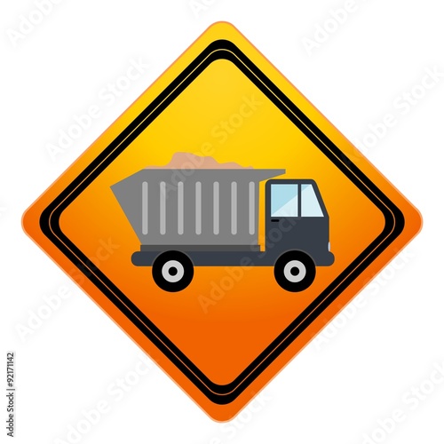 Truck with sand under construction sign
