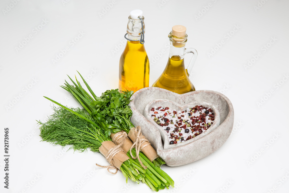 bunches of herbs, spices in a stone bowls and olive oil bunches of herbs, spices in a stone bowls and olive oil