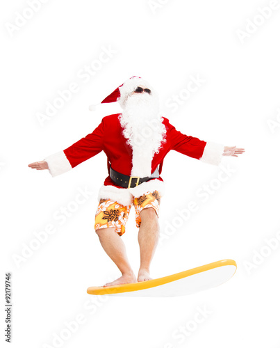Photography Happy Santa Claus surfing with surf board