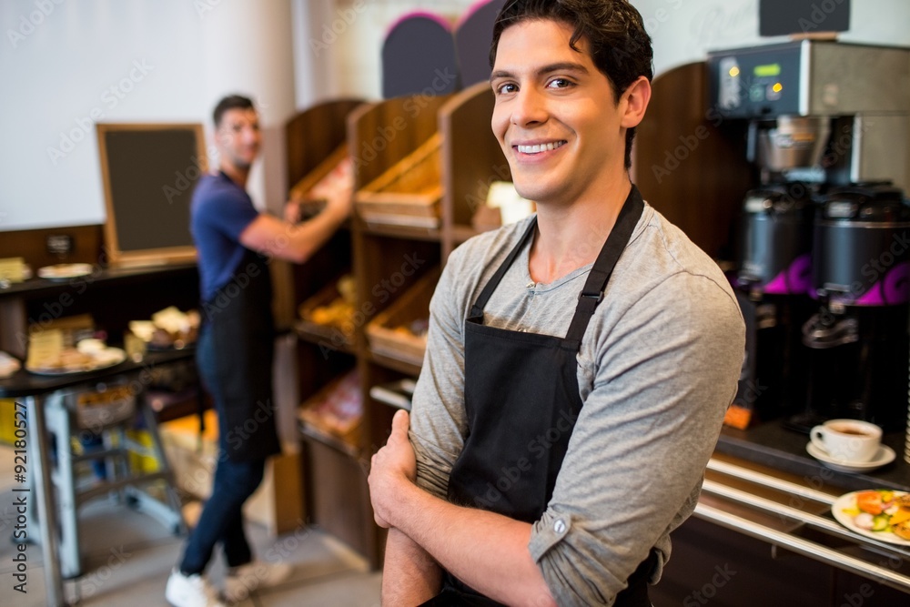 Handsome waiters smiling at camera Handsome waiters smiling at camera