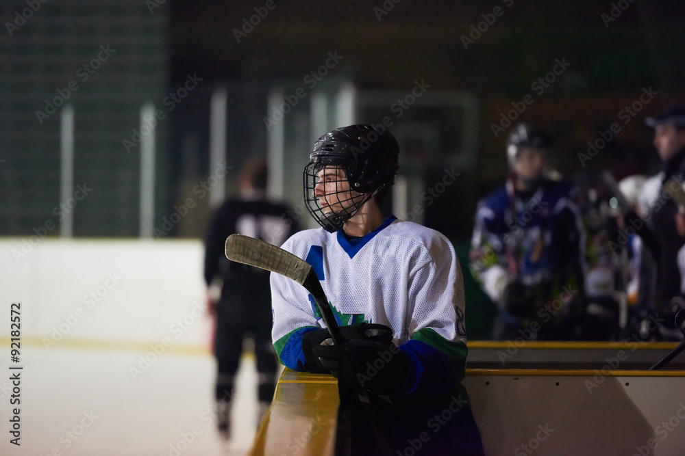 Fototapeta premium ice hockey players on bench