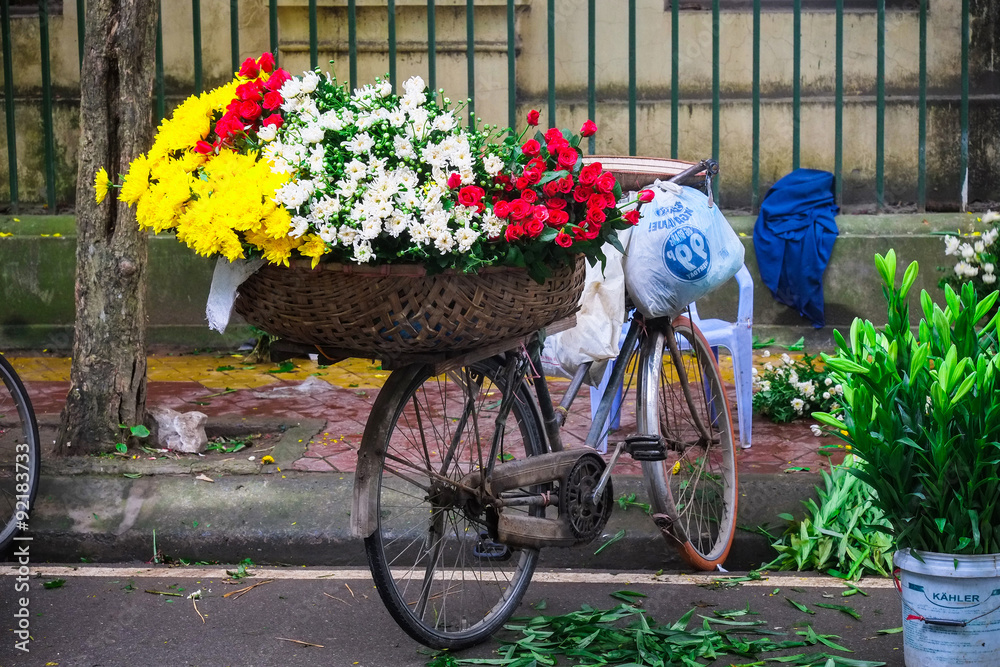 Flower on bicycle in small market, hanoi, vietnam