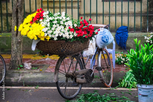 Flower on bicycle in small market, hanoi, vietnam