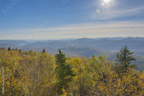 Colorful Autumn view on a sunny day with The Great Sacandaga Lake in the distance. © spectrumx86