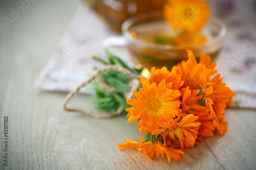 Fototapeta Naklejka Na Ścianę i Meble -  Herbal tea with marigold flowers