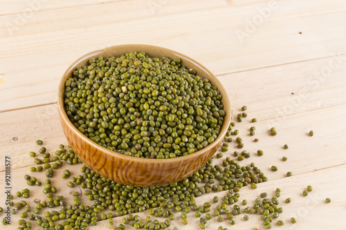 green beans on wood background