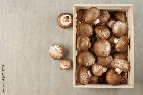 Brown cap mushrooms in box