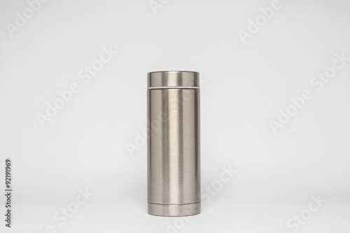 Grey metal water flask on a white background