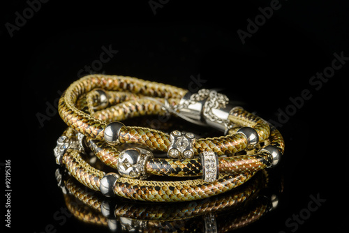 jewelry and bracelets on a black background 