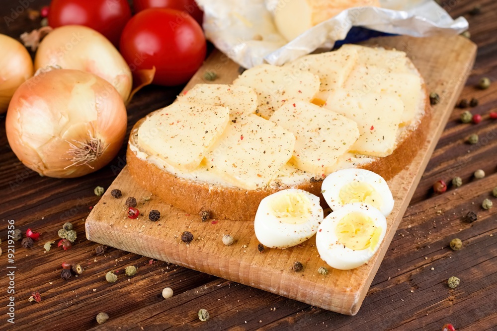 Bread with butter and slices of romadur cheese and eggs Bread with butter and slices of romadur cheese and eggs
