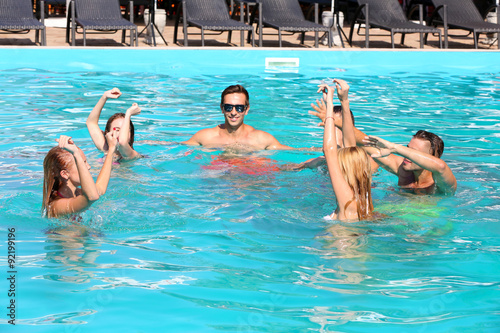 Young people having fun in the swimming pool