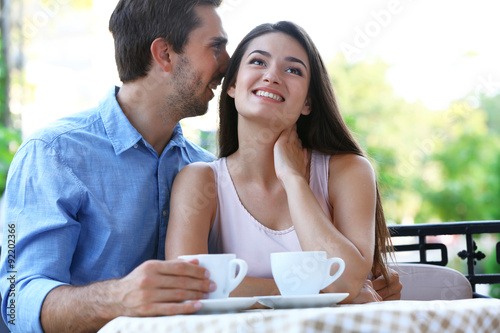 Young couple in street cafe