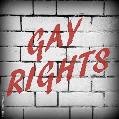 Gay Rights message in red text on a brick wall background processed in black and white for effect