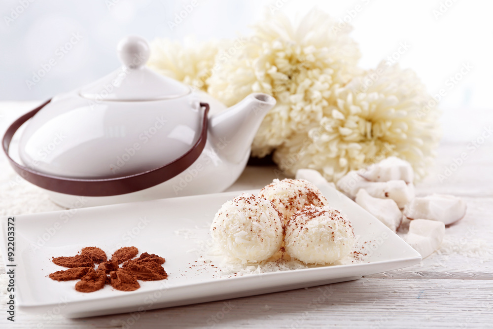 Fototapeta premium Homemade coco sweets on plate, on light background