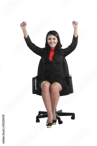Business woman sitting on the chair raise hand