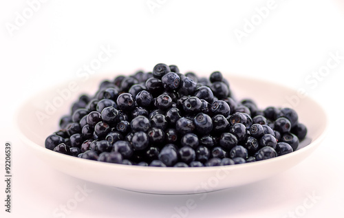 blueberries in a white plate
