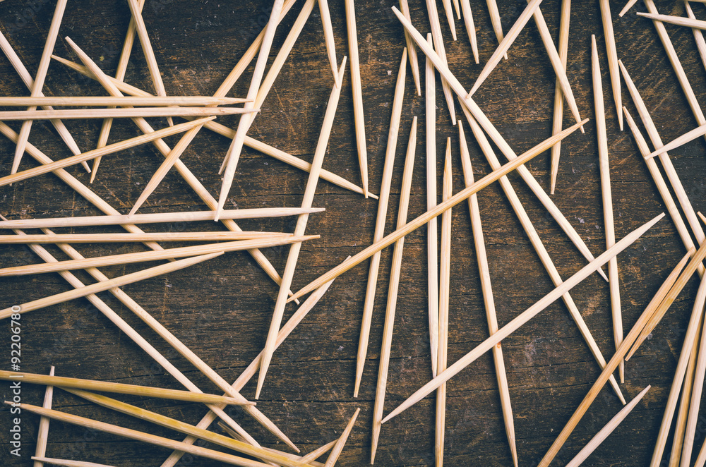 Many toothpicks lying in pile facing different directions on a