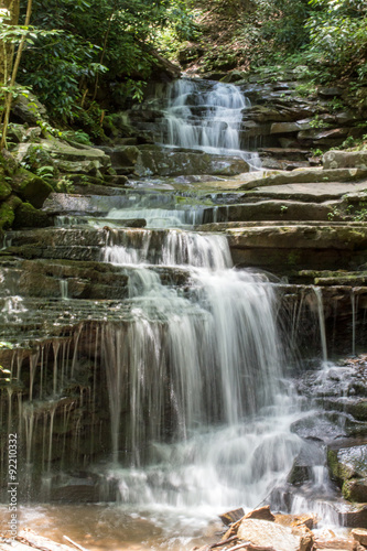Fototapeta Naklejka Na Ścianę i Meble -  Central PA Waterfall - Water Falls Down through the Green Pennsylvania Forest Over Flat Stone