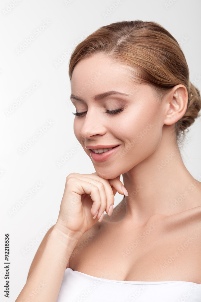 Cheerful healthy girl is caring of her body Cheerful healthy girl is caring of her body