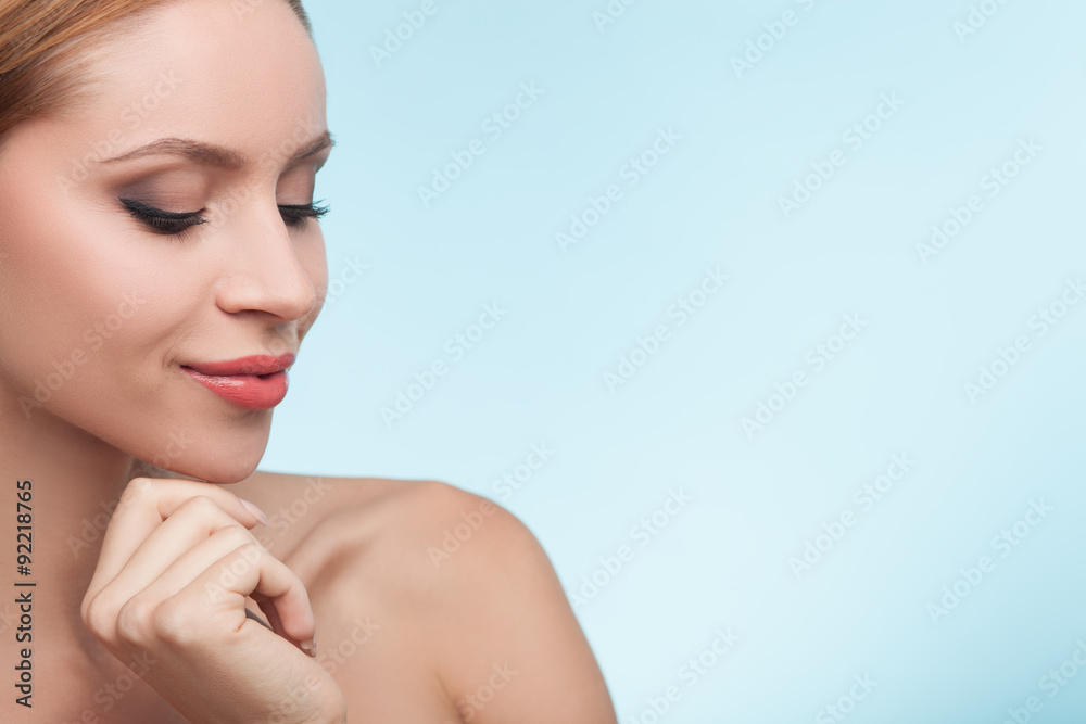 Naklejka premium Cheerful young girl with beautiful smooth skin