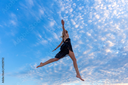 Young beautiful woman jumping