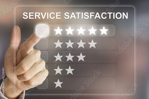 business hand pushing service satisfaction on virtual screen