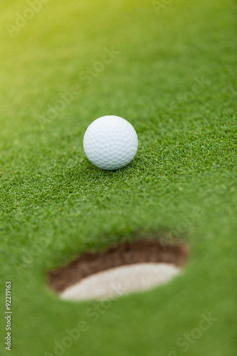 Golf ball on the green lawn