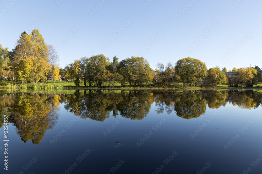 Trees reflecting in the water and lots of colors Trees reflecting in the water and lots of colors