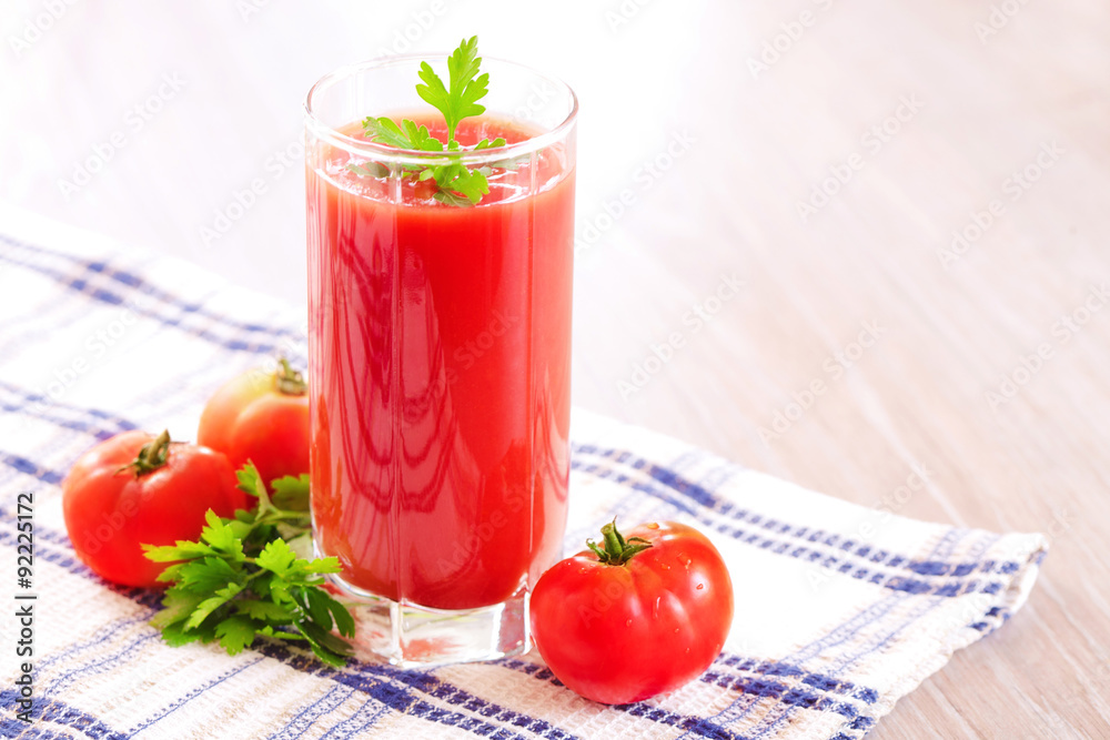 Glass of fresh tomato juice on the table Glass of fresh tomato juice on the table