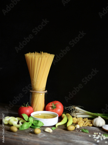 Italian and Mediterranean food ingredients on old wooden backgro
