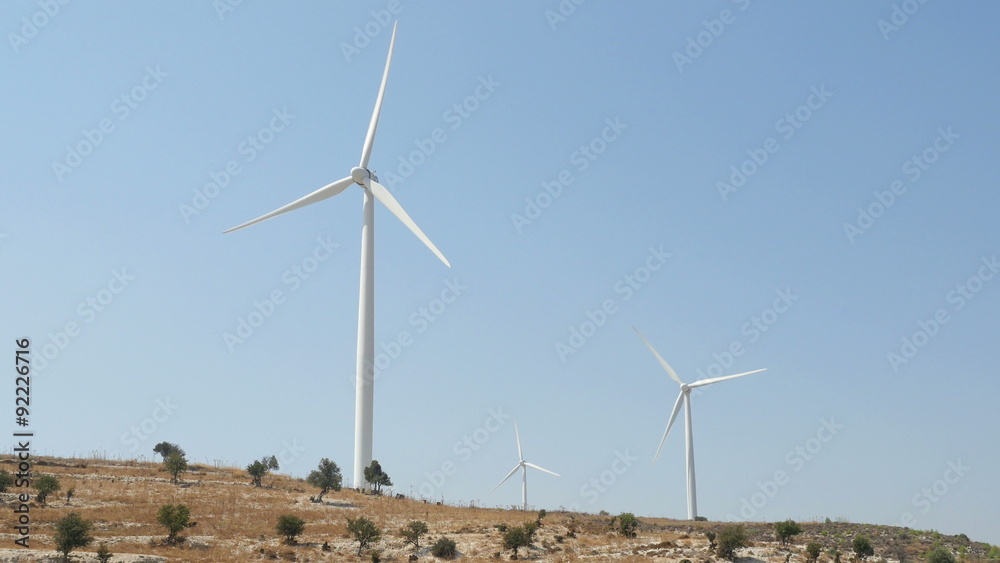 Wind turbines in a field with blue sky. 4K UHD.
Wind turbines in a field with blue sky. 4K UHD.