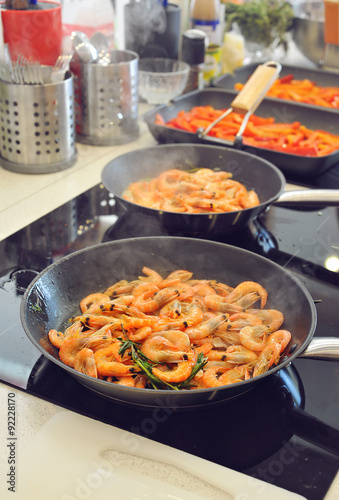 Stage of cooking pasta with shrimp, grilling shrimp. Selective