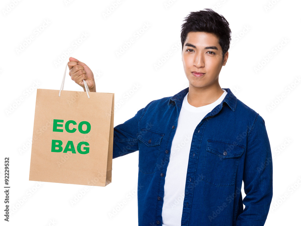 Man hold with shopping bag and showing phrase of eco bag Man hold with shopping bag and showing phrase of eco bag